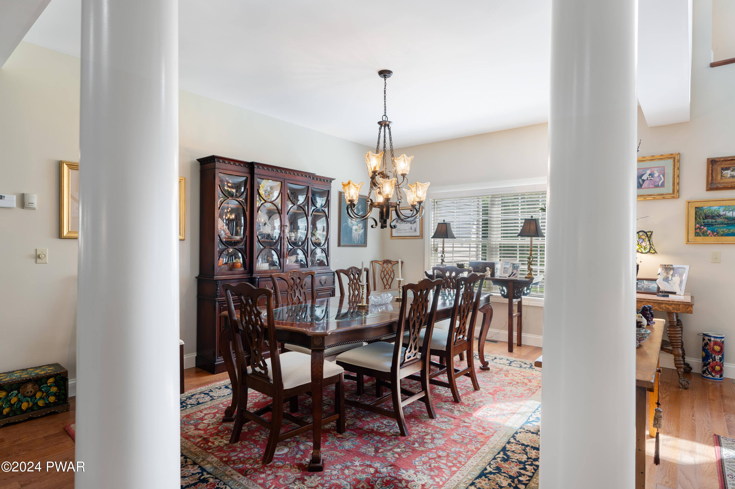 208 Long Meadow Road Milford, PA 18337 - Photo 6 of 64 a view of a dining room with furniture and chandelier
