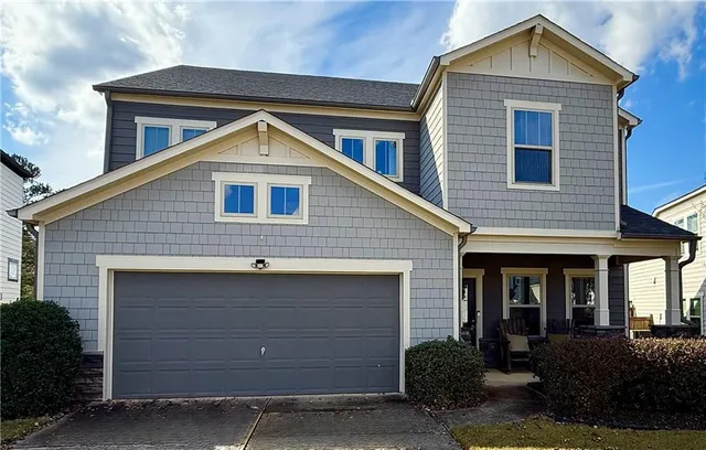 a front view of a house with garage