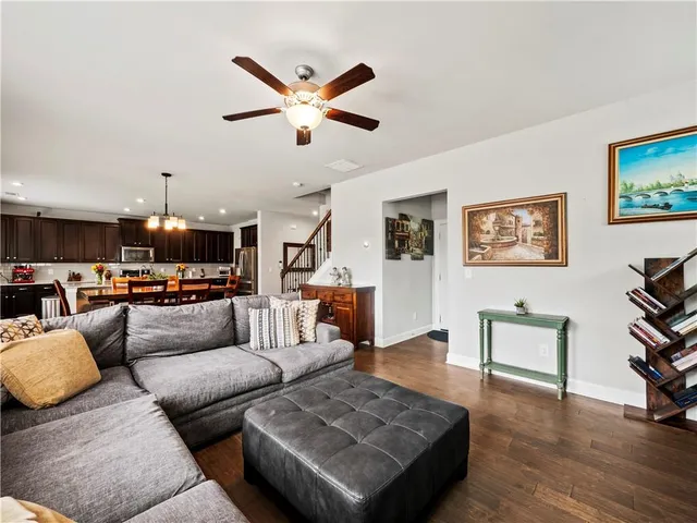 a large kitchen with kitchen island a large counter space a sink appliances and dining table