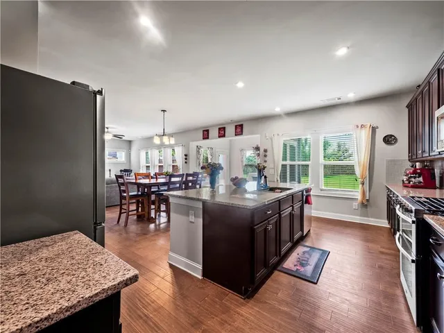a living room with furniture and painting on the wall