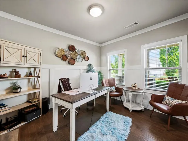 a bed sitting in a bedroom next to a cabinet