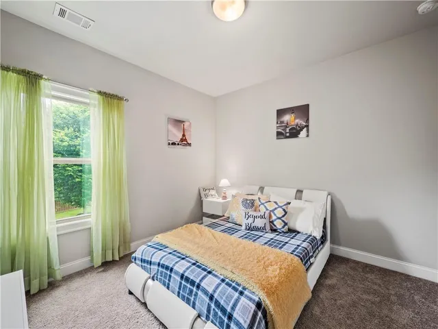 a bench is sitting in front of a building