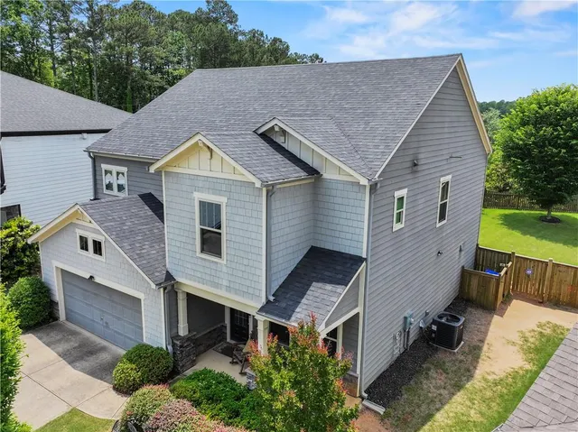 a aerial view of a house with a yard