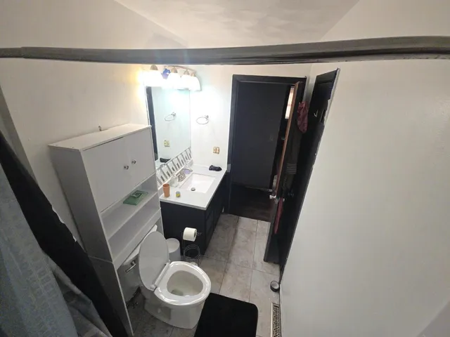 a bathroom with a sink and toilet