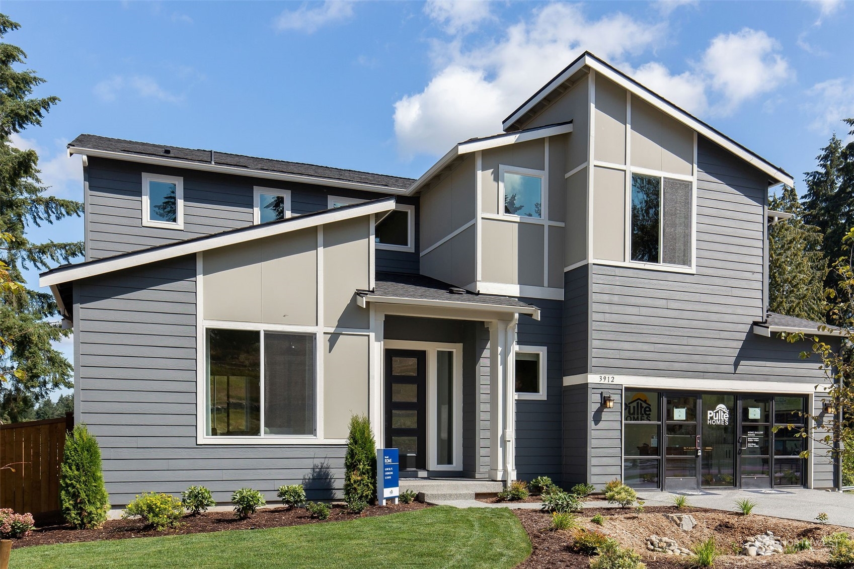 3900 Northeast 27th Place, Unit 3 Renton, WA 98059 - Photo 1 of 37 a front view of a house with a yard