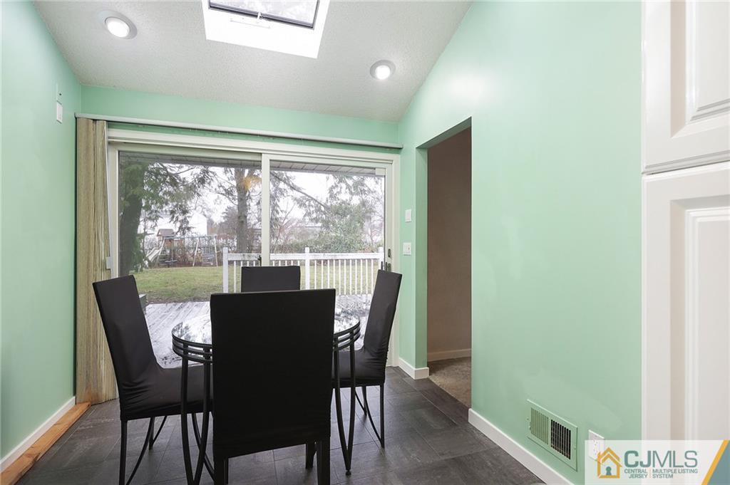 2 Rumson Road Kendall Park, NJ 08824 - Photo 11 of 28 a view of a dining room with furniture window and outside view