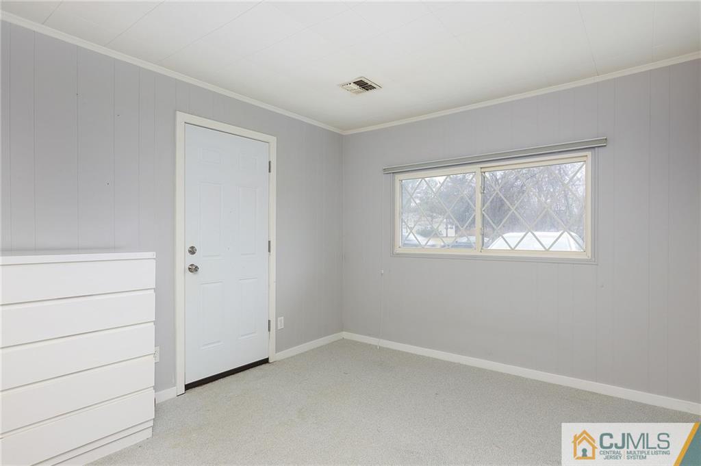 2 Rumson Road Kendall Park, NJ 08824 - Photo 14 of 28 a view of an empty room with a window