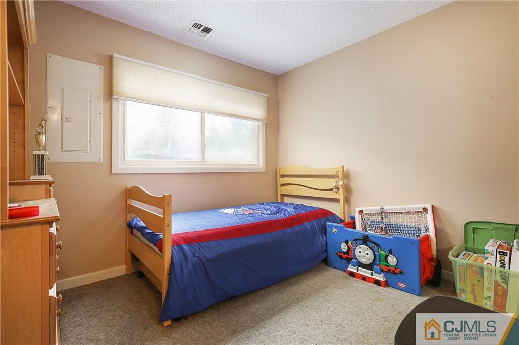 2 Rumson Road Kendall Park, NJ 08824 - Photo 16 of 28 a bedroom with a bed and a window