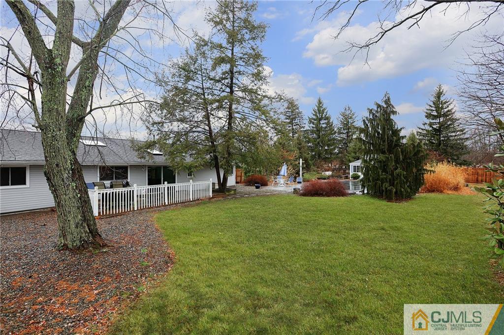 2 Rumson Road Kendall Park, NJ 08824 - Photo 25 of 28 a view of a large garden with plants and large trees