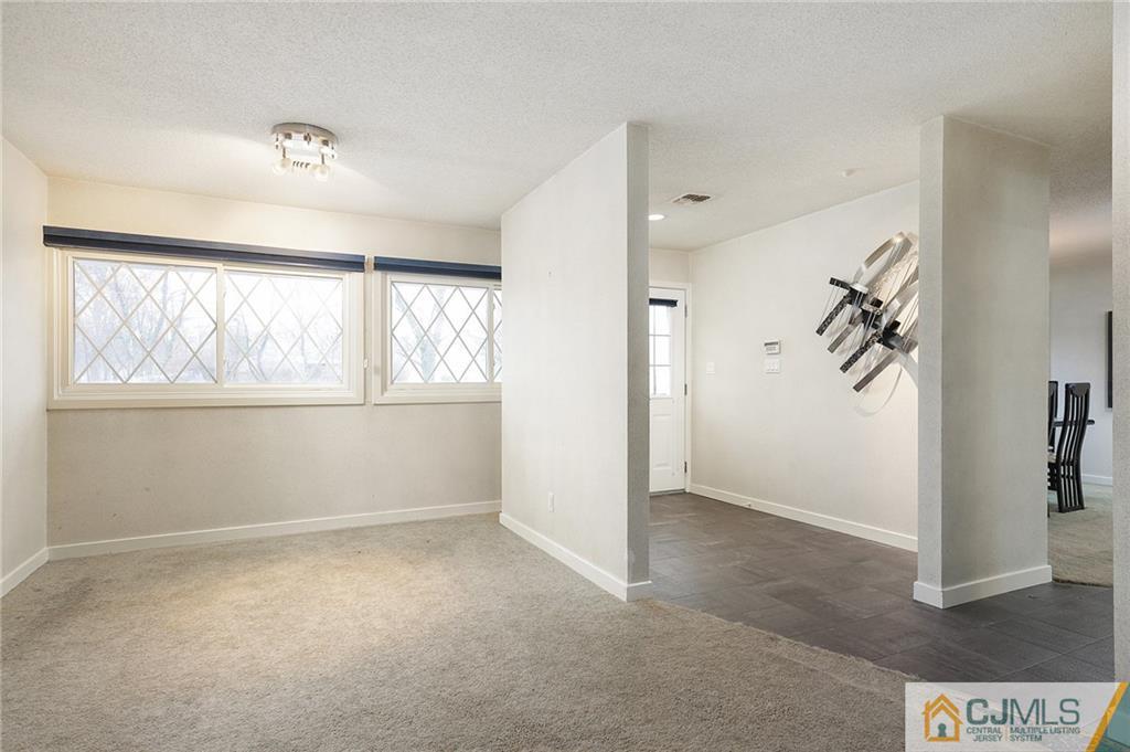 2 Rumson Road Kendall Park, NJ 08824 - Photo 4 of 28 an empty room with windows and closet