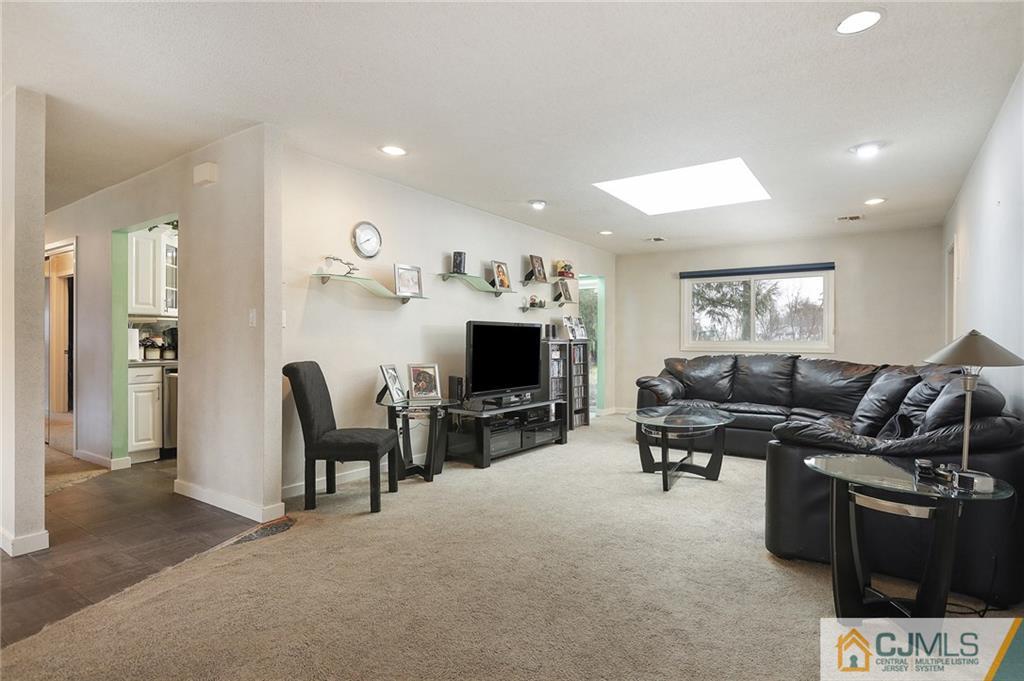 2 Rumson Road Kendall Park, NJ 08824 - Photo 5 of 28 a living room with furniture and a fireplace