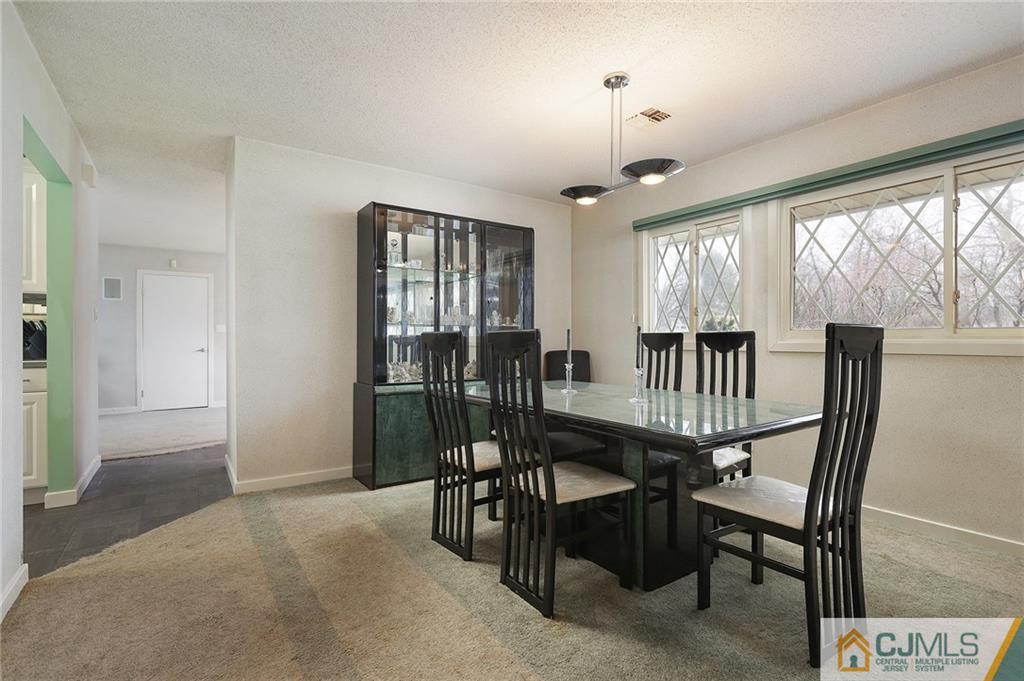 2 Rumson Road Kendall Park, NJ 08824 - Photo 7 of 28 a view of a dining room with furniture window and outside view