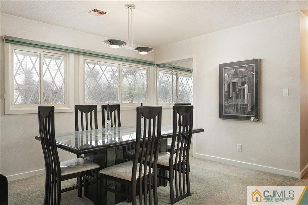 2 Rumson Road Kendall Park, NJ 08824 - Photo 8 of 28 a view of a dining room with furniture window and outside view