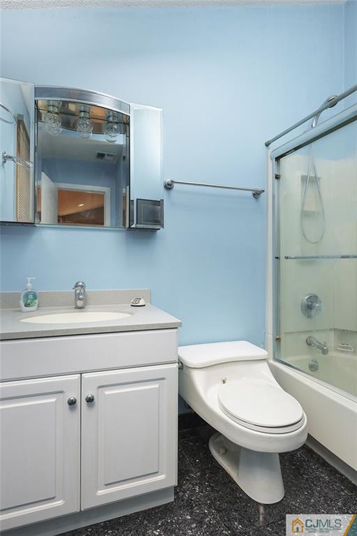 2 Rumson Road Kendall Park, NJ 08824 - Photo 10 of 28 a bathroom with a toilet a sink and bathtub