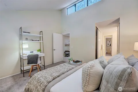 a bedroom with a bed and a chair