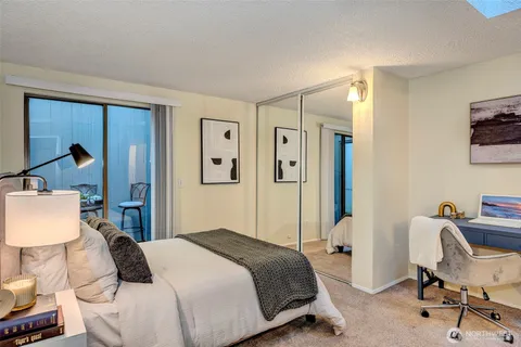 a bedroom with a bed and a chair