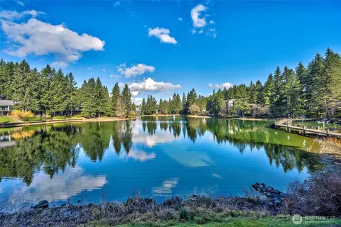 a view of a lake in middle of a city