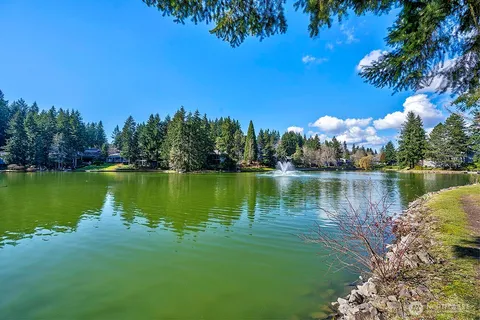 a view of a lake with houses in the back
