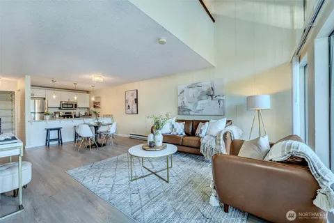 a living room with furniture and a lamp