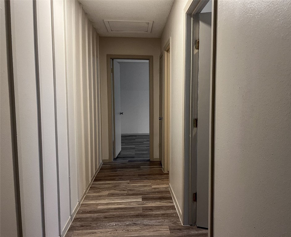 7206 Creekside Drive, Unit C Austin, TX 78752 - Photo 12 of 22 a view of a hallway with wooden floor and staircase