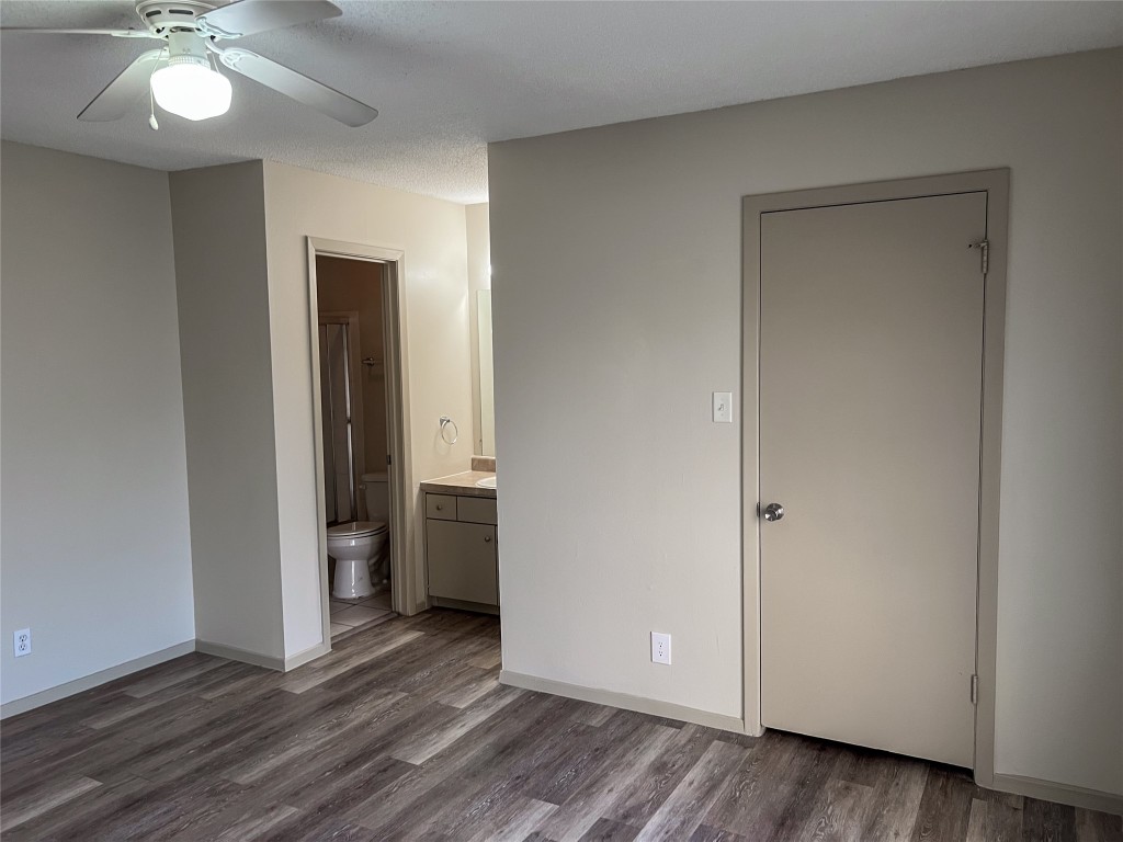 7206 Creekside Drive, Unit C Austin, TX 78752 - Photo 14 of 22 an empty room with wooden floor and closet