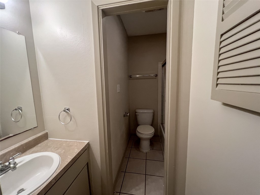 7206 Creekside Drive, Unit C Austin, TX 78752 - Photo 18 of 22 a bathroom with a sink toilet and vanity