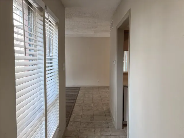 a view of a kitchen with a sink and cabinets