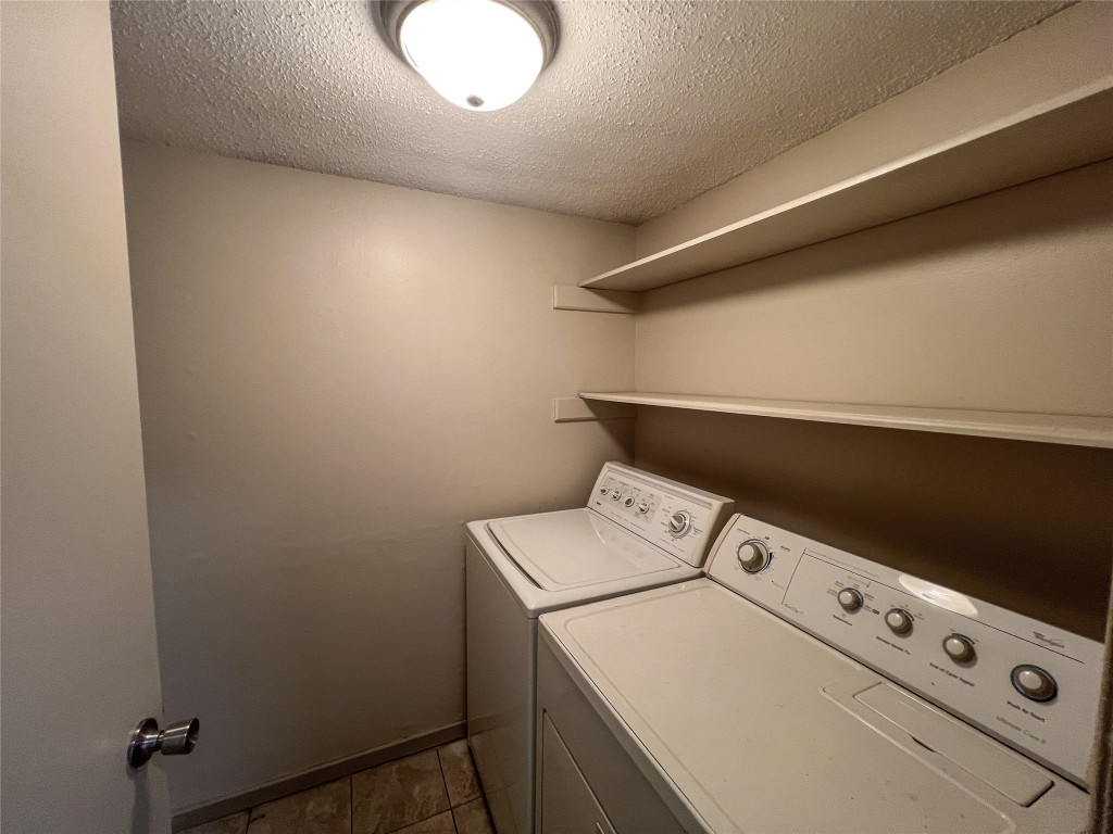 7206 Creekside Drive, Unit C Austin, TX 78752 - Photo 9 of 22 a utility room with dryer and washer