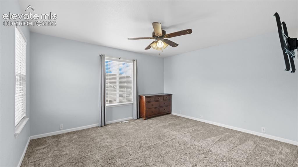 4023 Diamond Ridge View Colorado Springs, CO 80918 - Photo 15 of 31 an empty room with closet and windows