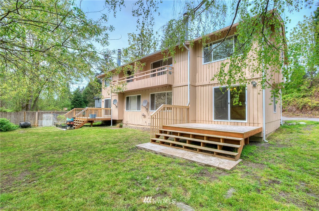 13933 Southeast Allen Road Bellevue, WA 98006 - Photo 1 of 11 a view of a house with backyard sitting area and garden