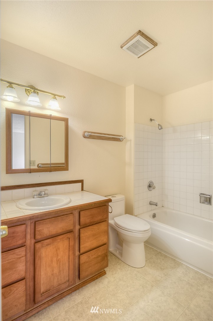 13933 Southeast Allen Road Bellevue, WA 98006 - Photo 8 of 11 a bathroom with a toilet sink and mirror