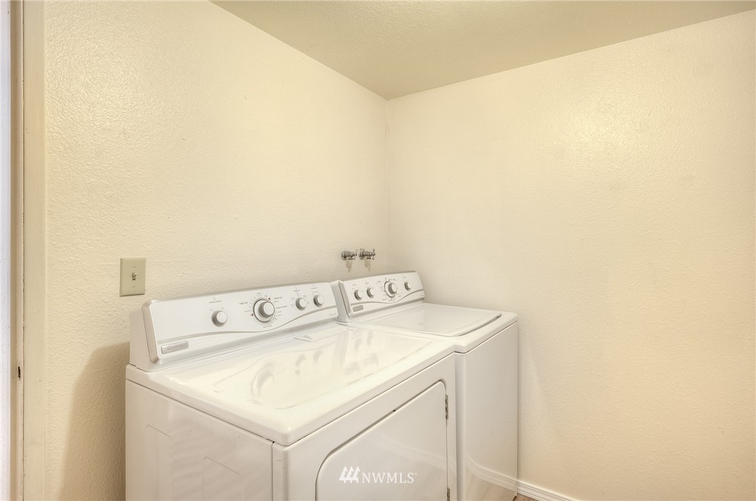 13933 Southeast Allen Road Bellevue, WA 98006 - Photo 10 of 11 a utility room with dryer and washer