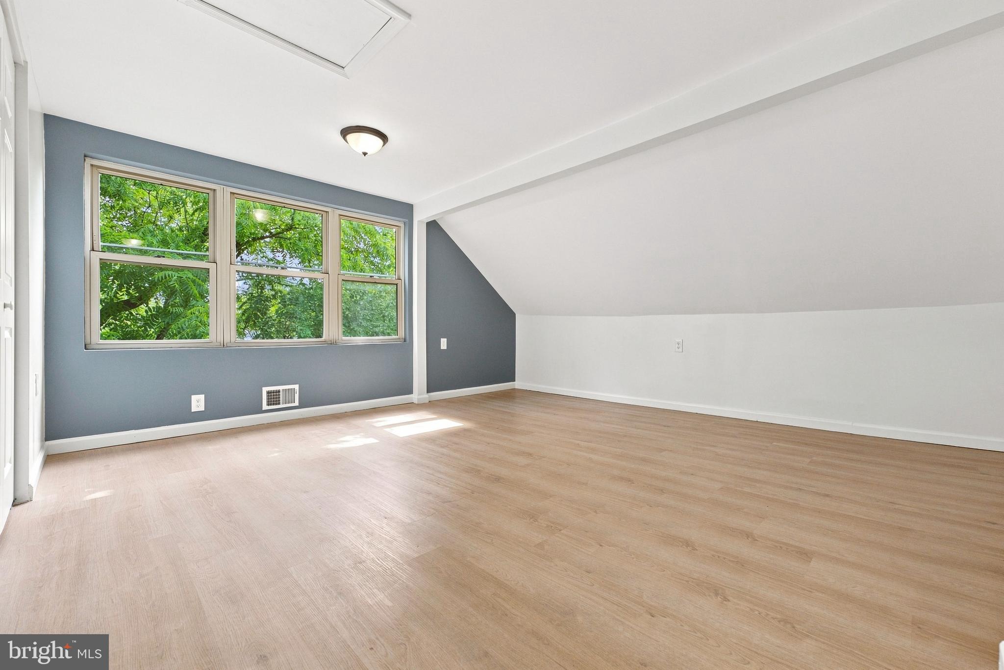 185 Rancocas Road Mount Holly, NJ 08060 - Photo 26 of 34 a view of an empty room with wooden floor and a window