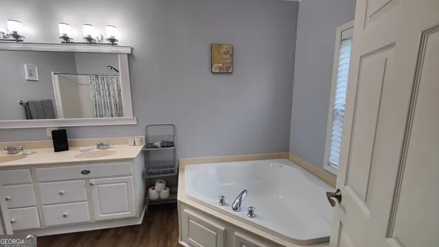 a bathroom with a sink and mirror