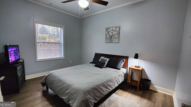 a bed room with a bed and a tv