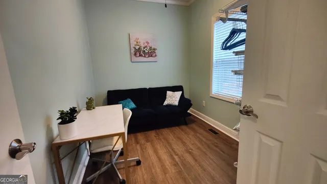 a front view of a house with a table and chairs