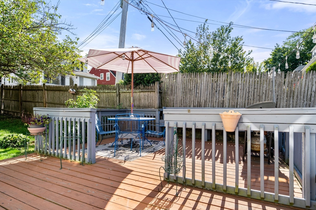 87 Waldeck Road Milton, MA 02186 - Photo 18 of 21 a view of a wooden deck with furniture