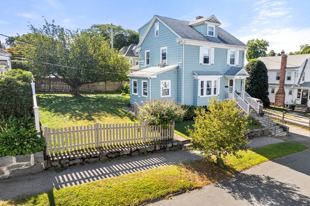 87 Waldeck Road Milton, MA 02186 - Photo 2 of 21 a front view of a house with a garden