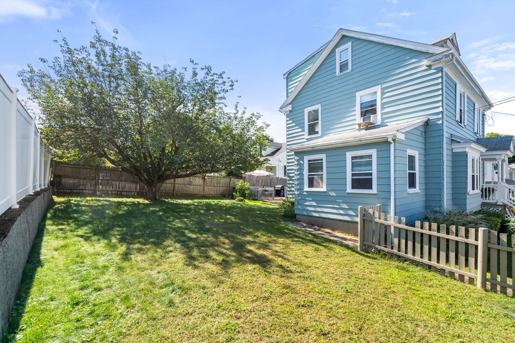 87 Waldeck Road Milton, MA 02186 - Photo 21 of 21 a front view of house with yard and green space