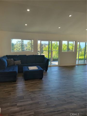 a living room with furniture window and wooden floor