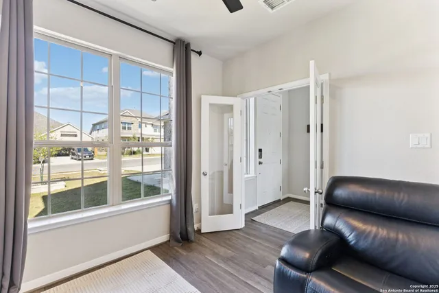 a living room with furniture and a window