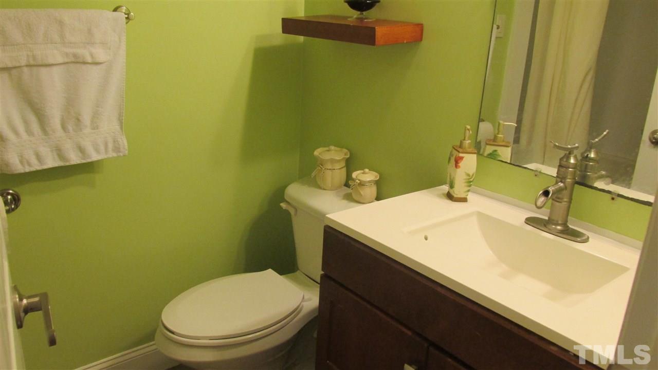 4823 Revere Road Durham, NC 27713 - Photo 11 of 15 a bathroom with a sink and a toilet