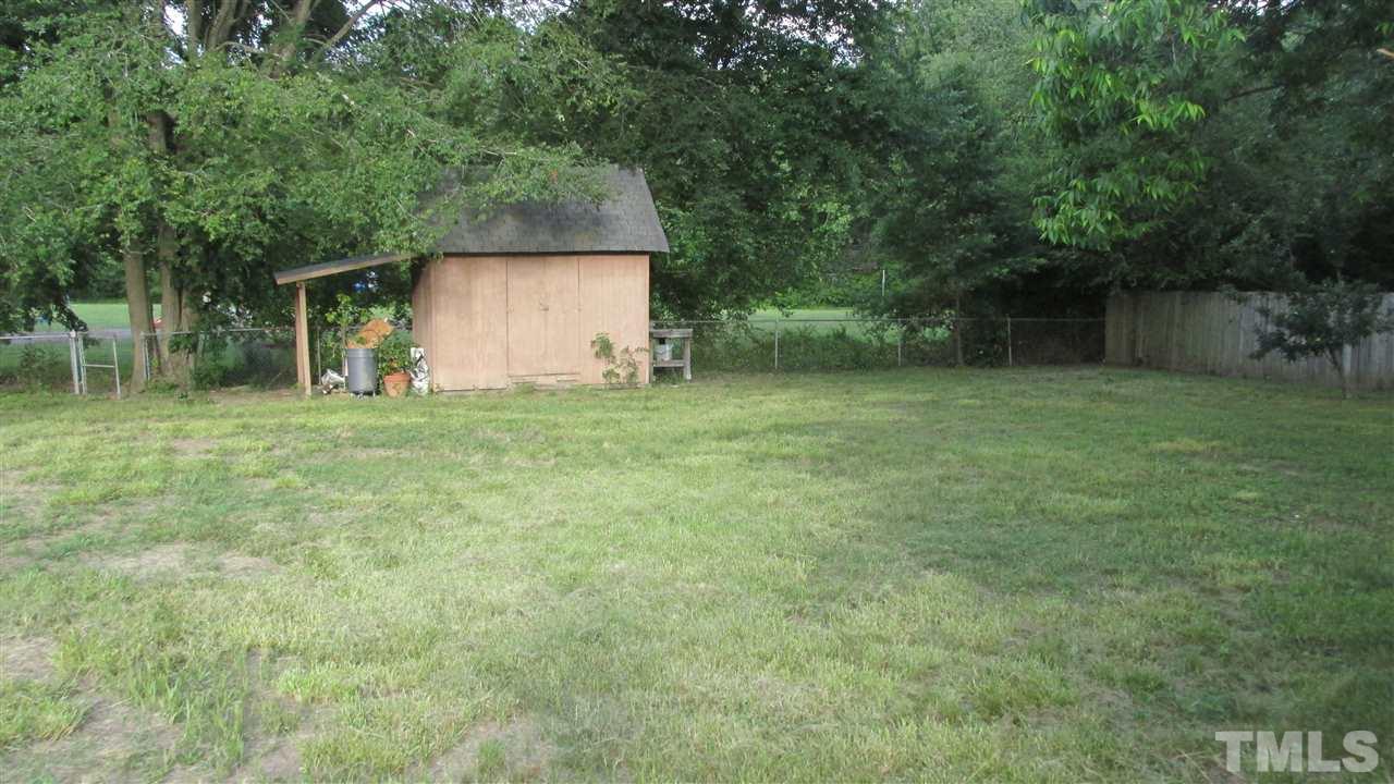 4823 Revere Road Durham, NC 27713 - Photo 15 of 15 a backyard of a house with lots of green space