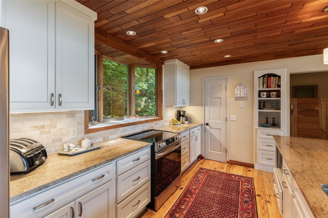 471 Rivard Road Glenville, NC 28736 - Photo 26 of 66 kitchen with pantry and built ins