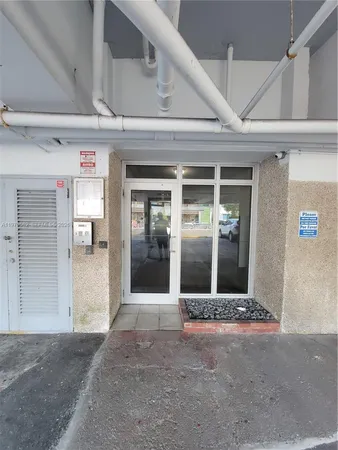 a kitchen with stainless steel appliances a stove a refrigerator and a sink