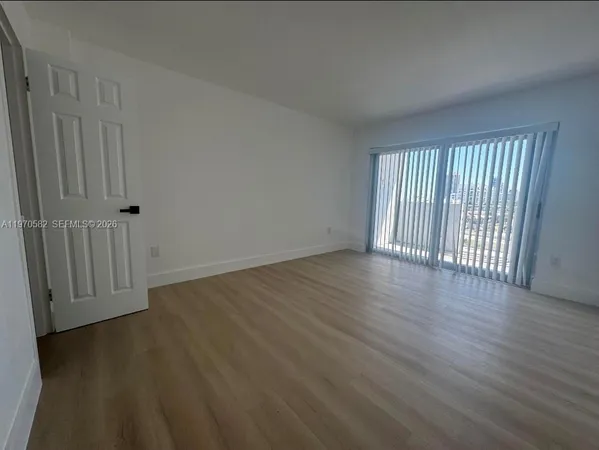 a white toilet sitting in a bathroom