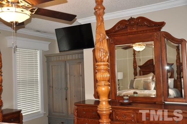 8512 Powis Circle Raleigh, NC 27615 - Photo 14 of 25 a living room with furniture and a flat screen tv
