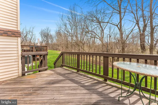 a view of a wooden deck and a yard
