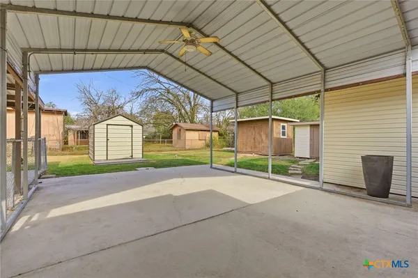 a view of a house with basketball court