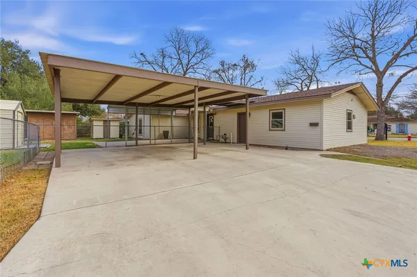 a house with trees in front of it